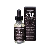 black tea scented beard oil with packaging