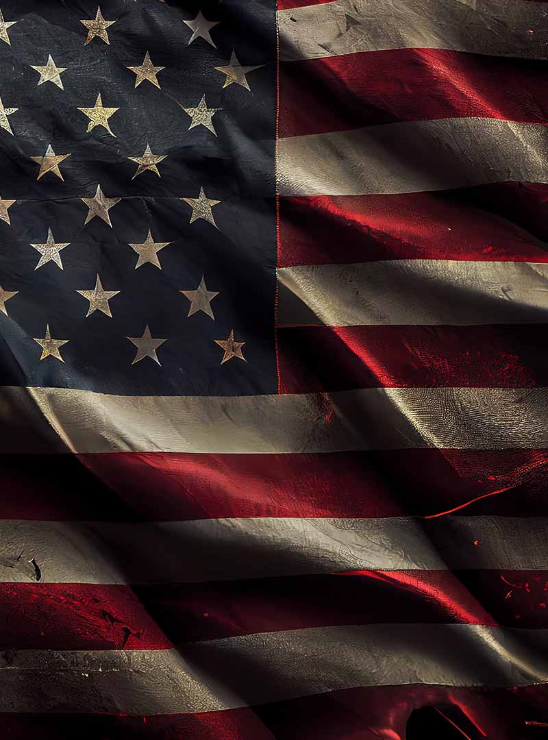 a low light dramatic high-contrast view of a rippled fabric united states flag for mobile devices