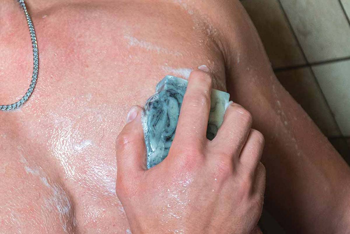 Soap lathered up on male chest